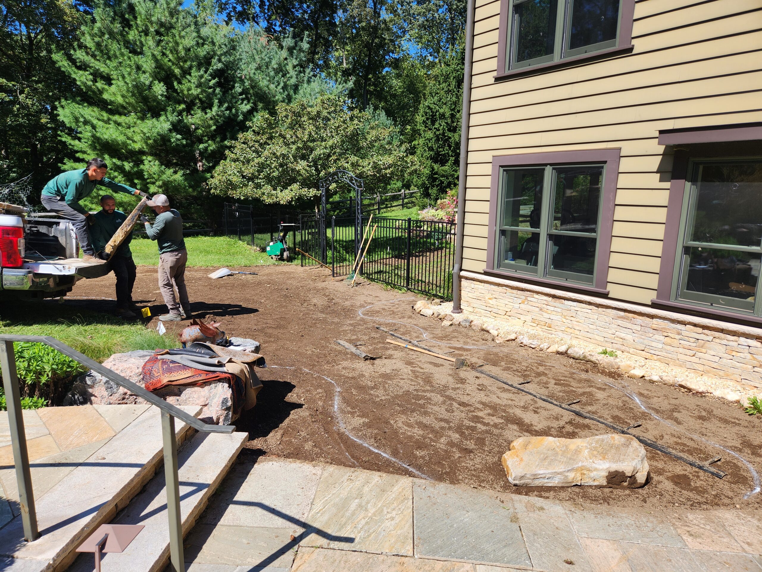 Removing turf from the adjacent area to expand the Zen Garden.