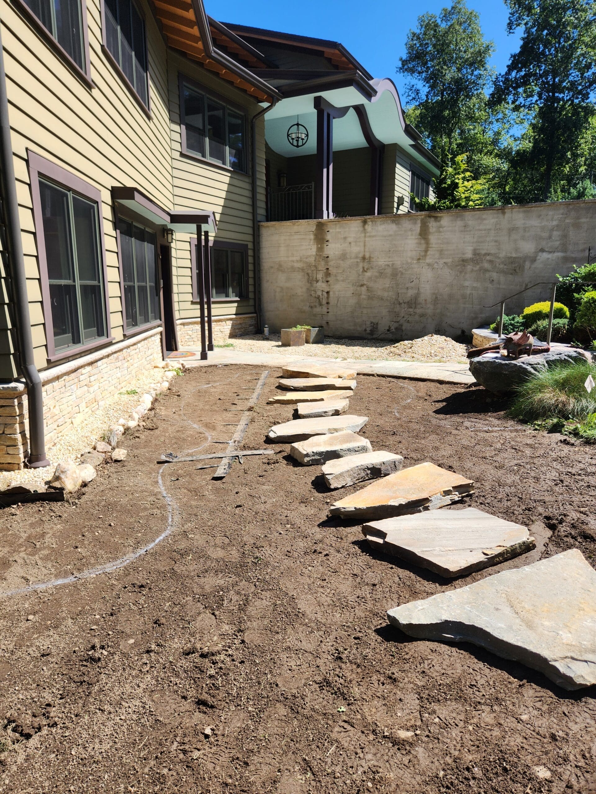 Natural stone path laid out by GJLD masons.