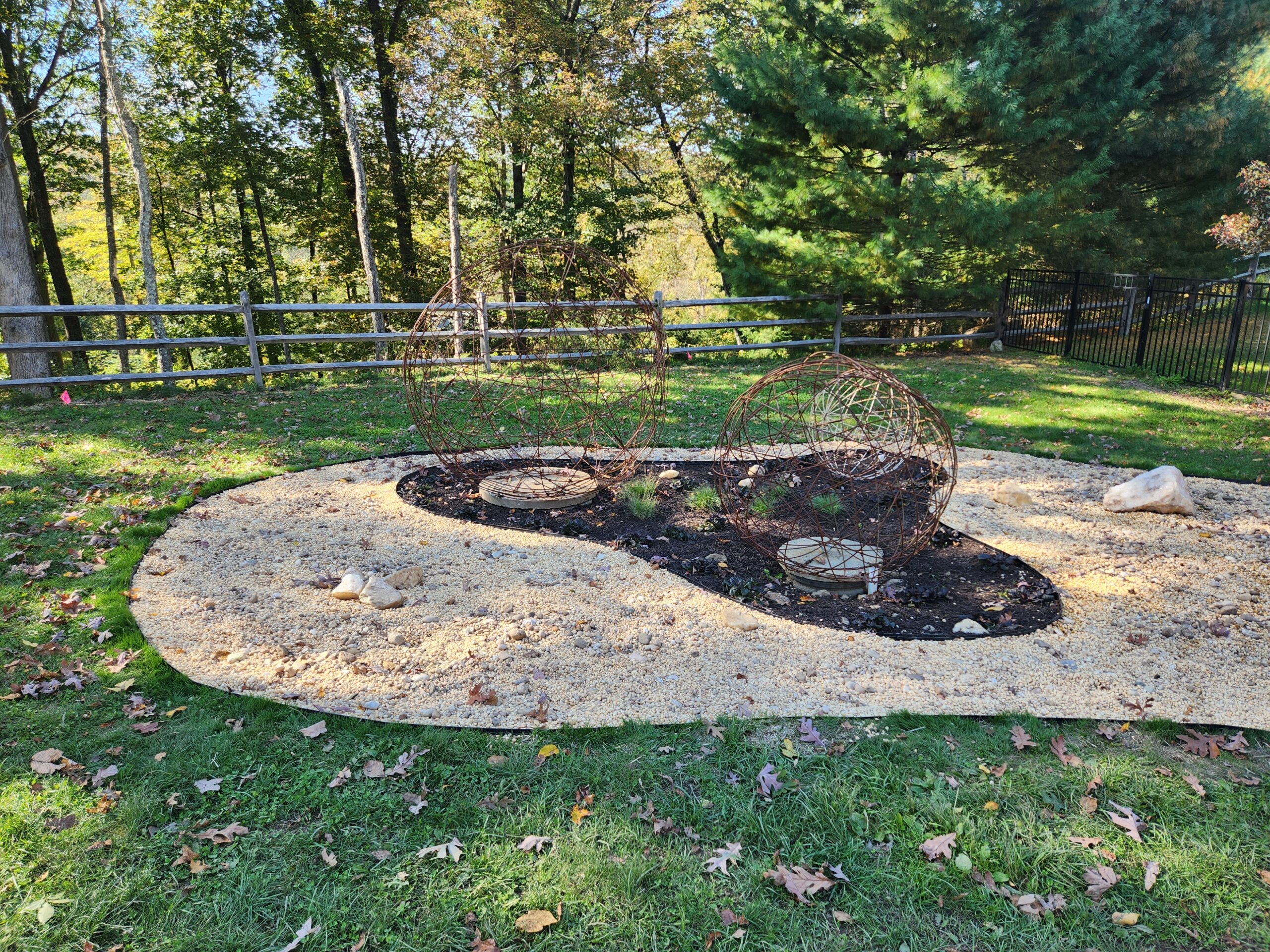 Gravel sculpture garden doubles as a septic tank cover.