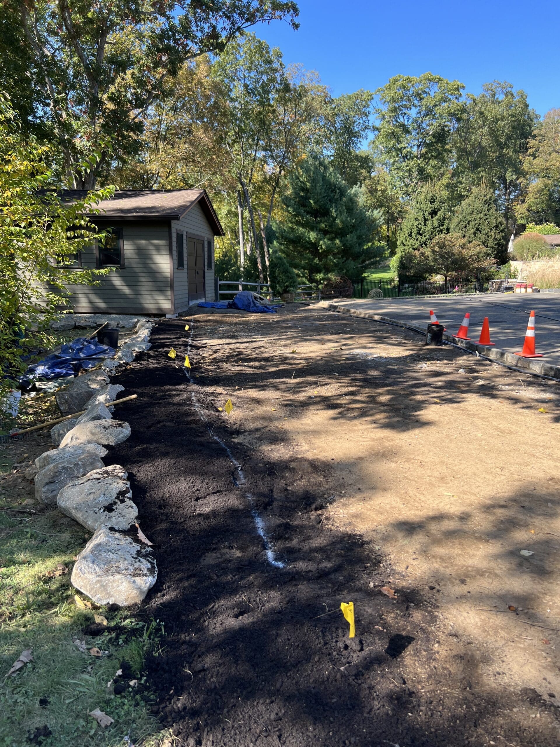 Boulder retaining feature and garden bed border installed, ready for planting!